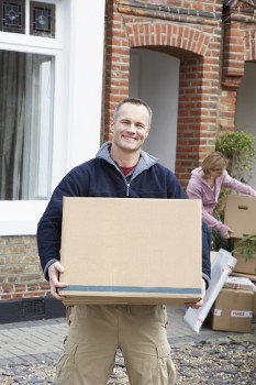Furniture collection team handling bulky items in a Catford home