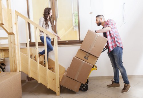 Packed boxes and furniture for a home move in Catford