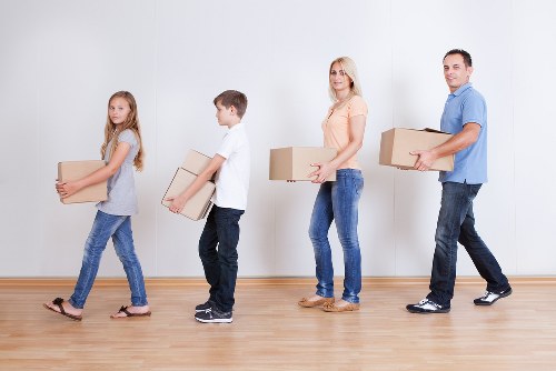 Removals team handling items in a Catford flat move