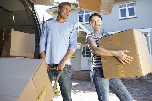 Loading furniture into a removal truck in a residential South London street